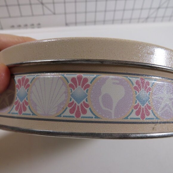 Sea Shell Metal Tin in Pink, Purple, Turquoise Round Tin on cream - Picture 2 of 8
